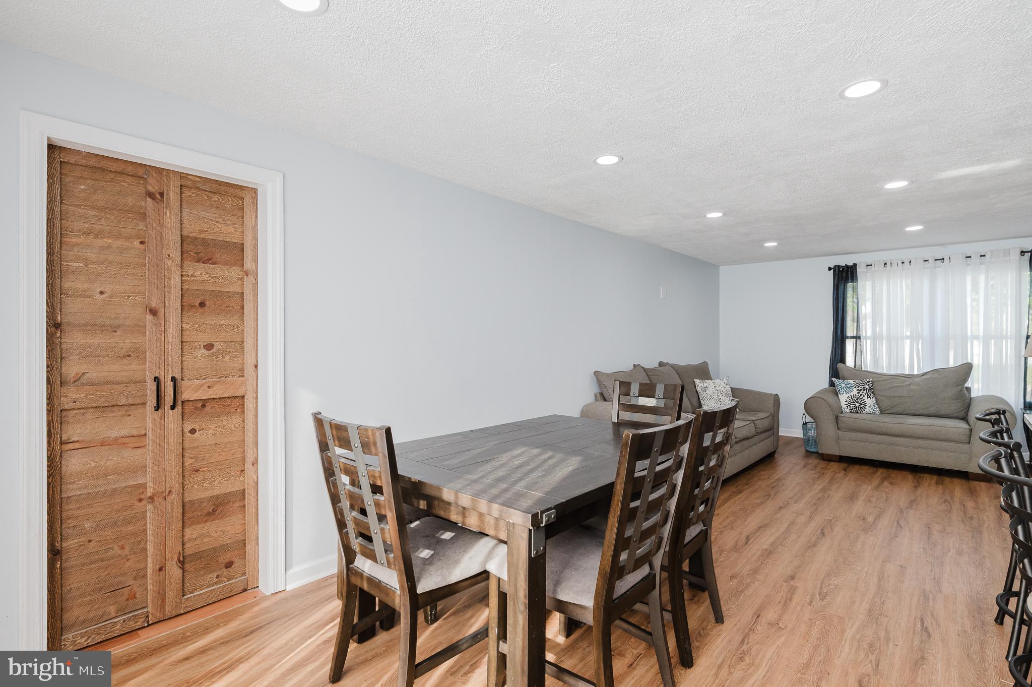 930 Edmund Street Aberdeen, MD 21001 - Photo 20 of 61 a view of a dining room with furniture and wooden floor