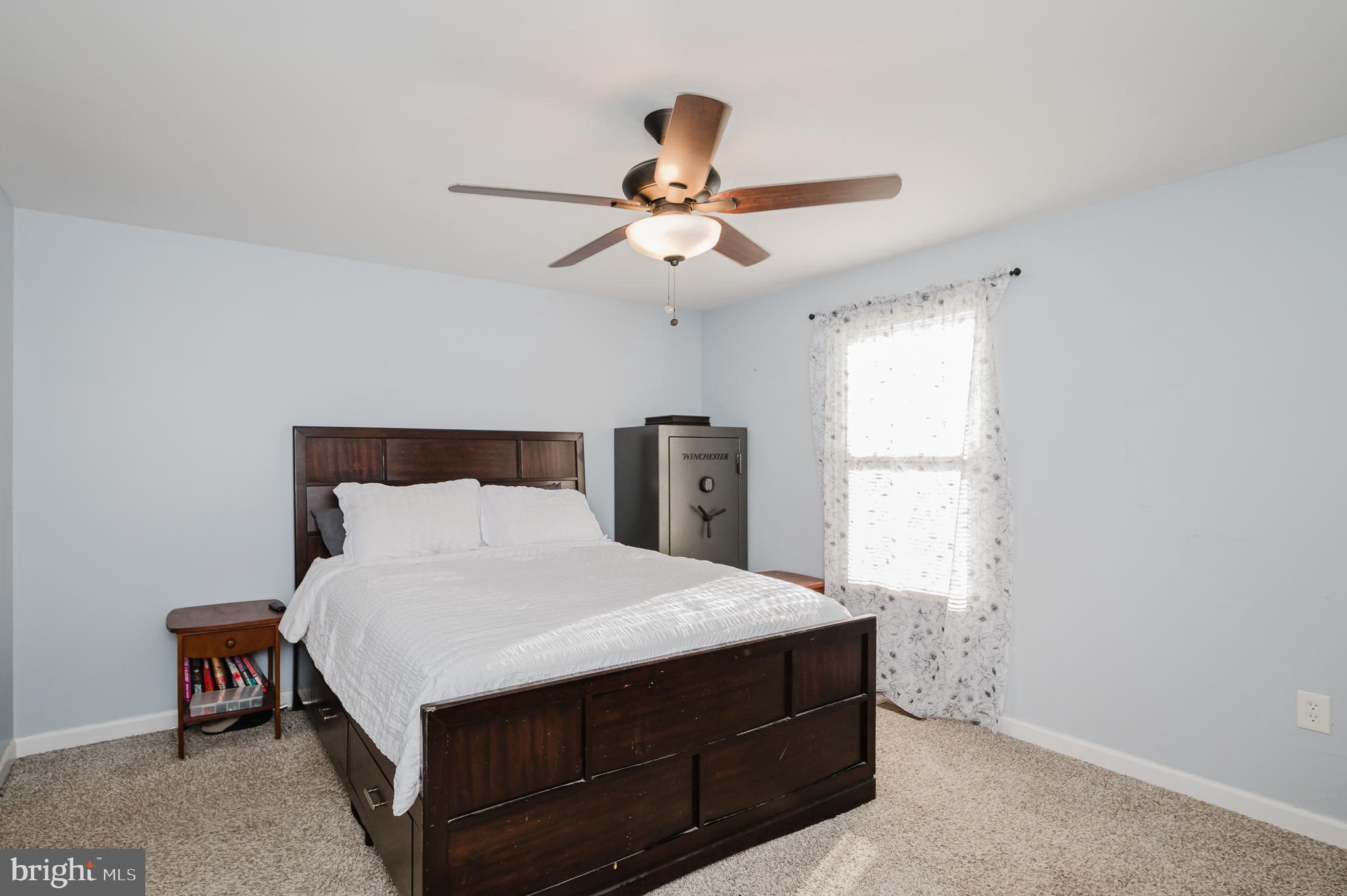 930 Edmund Street Aberdeen, MD 21001 - Photo 25 of 61 a bedroom with a bed and a chandelier