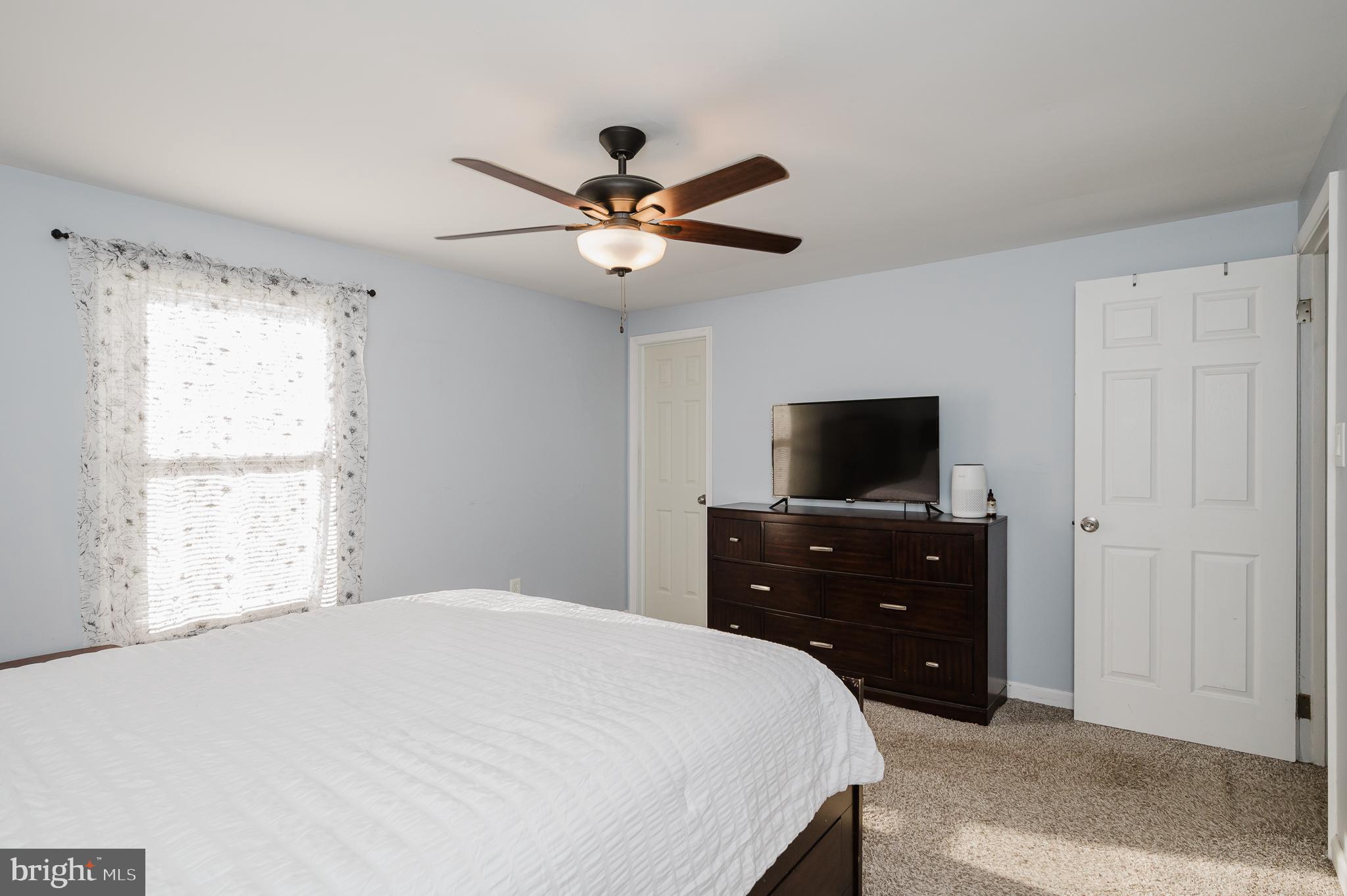 930 Edmund Street Aberdeen, MD 21001 - Photo 26 of 61 a bedroom with a bed and a flat screen tv