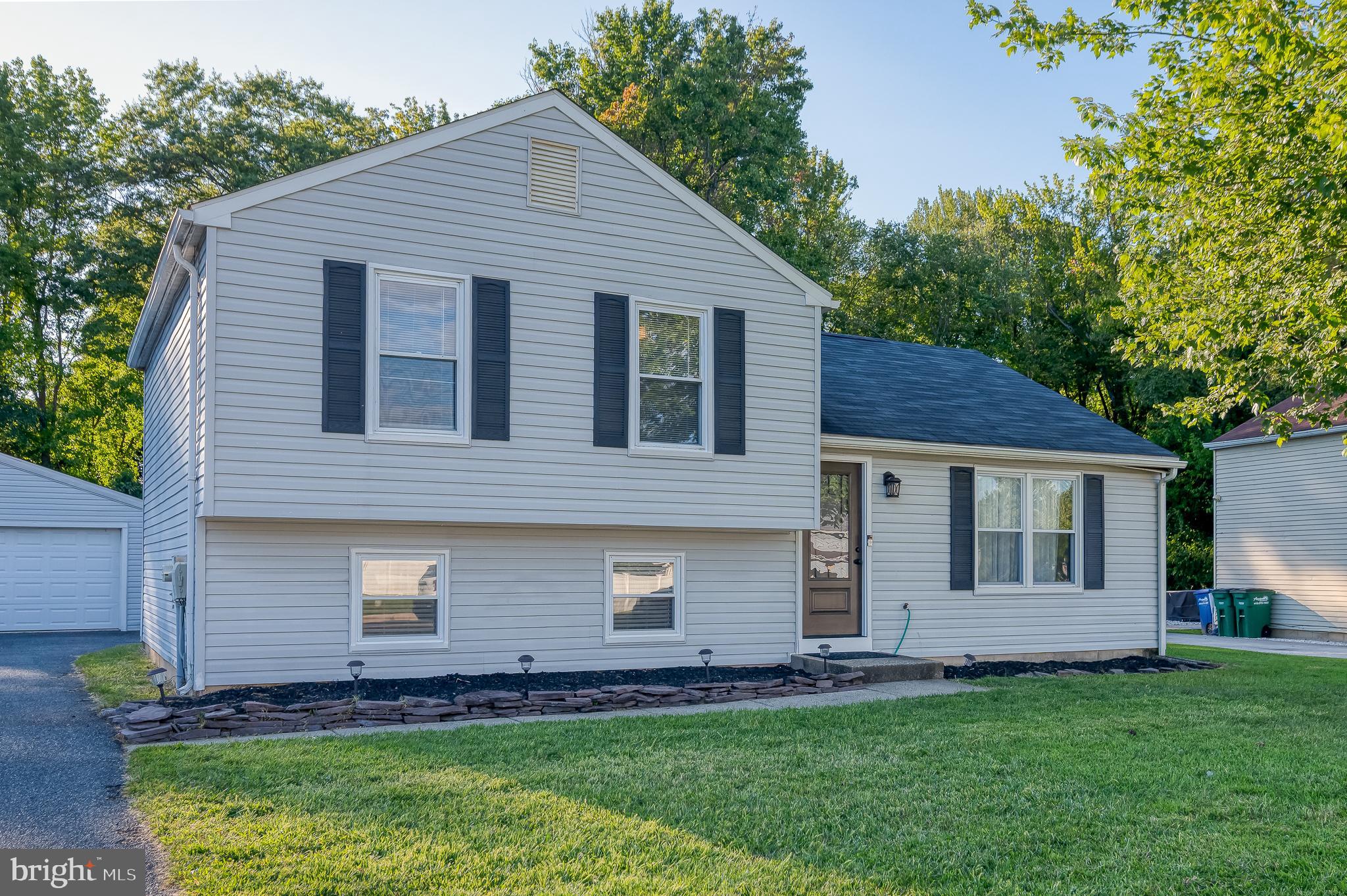 930 Edmund Street Aberdeen, MD 21001 - Photo 3 of 61 a front view of a house with a garden
