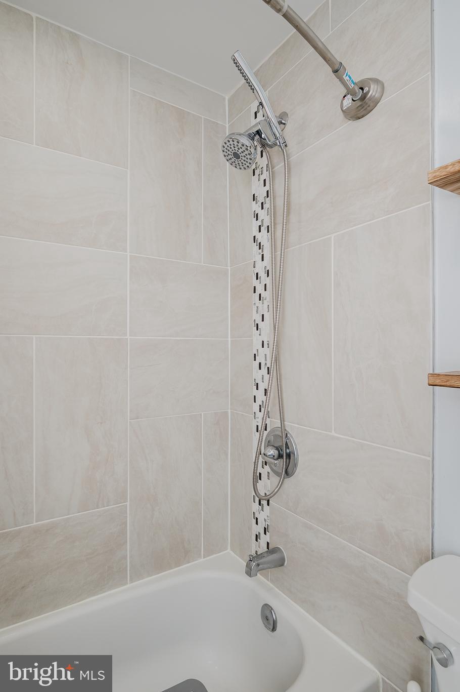 930 Edmund Street Aberdeen, MD 21001 - Photo 31 of 61 a bathroom with a bathtub and shower