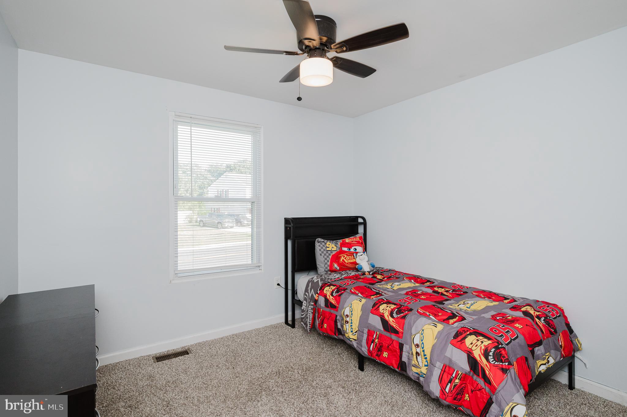 930 Edmund Street Aberdeen, MD 21001 - Photo 32 of 61 a bedroom with a bed and a chandelier