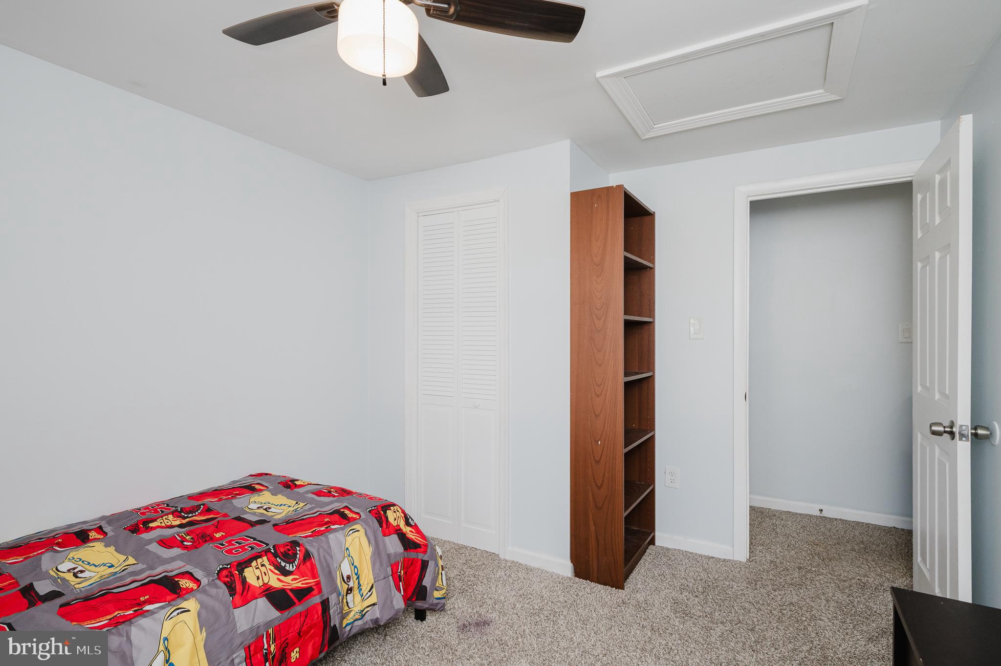 930 Edmund Street Aberdeen, MD 21001 - Photo 34 of 61 a bedroom with a bed and a chandelier