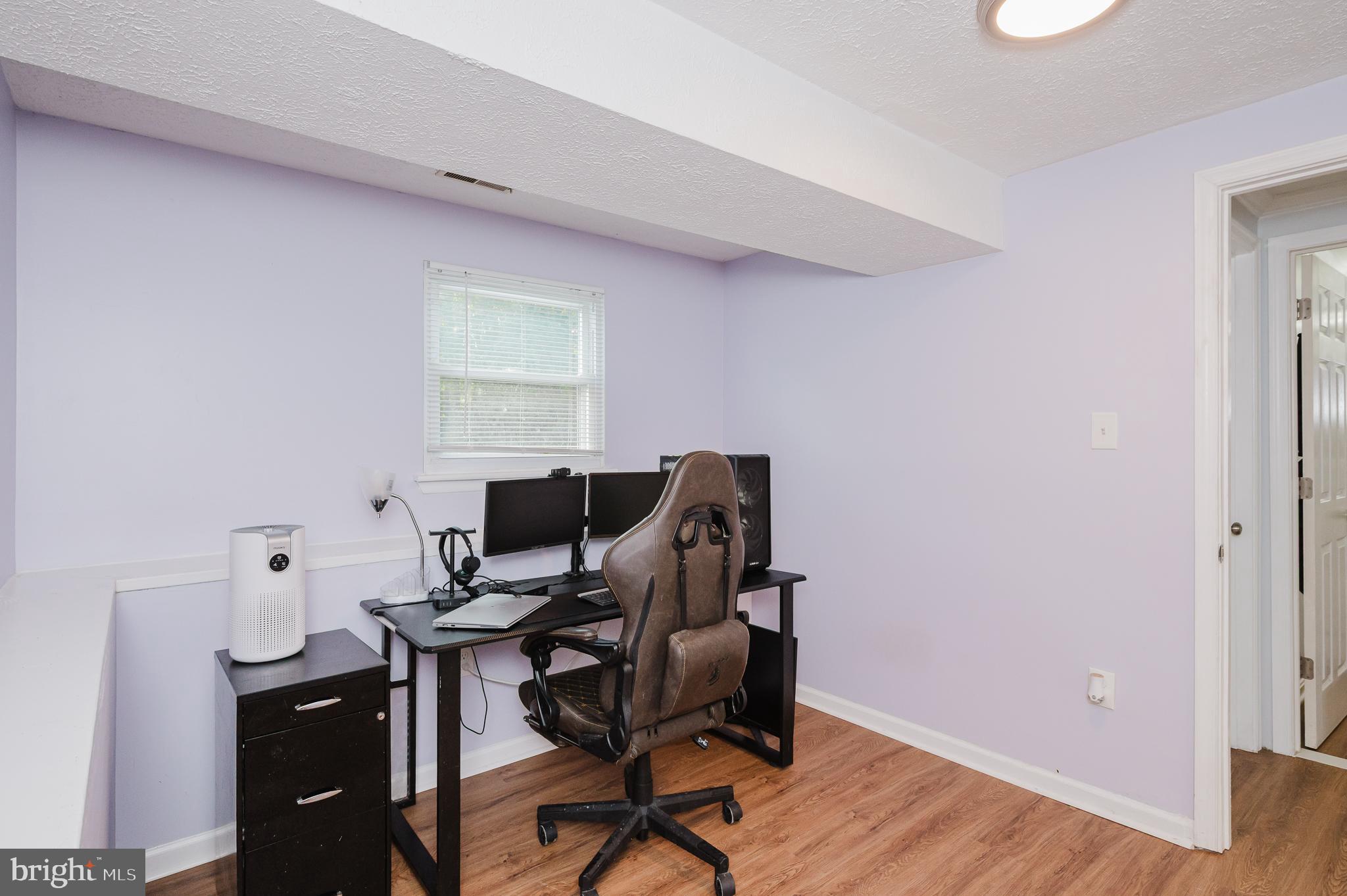 930 Edmund Street Aberdeen, MD 21001 - Photo 44 of 61 a view of a workspace with furniture and wooden floor