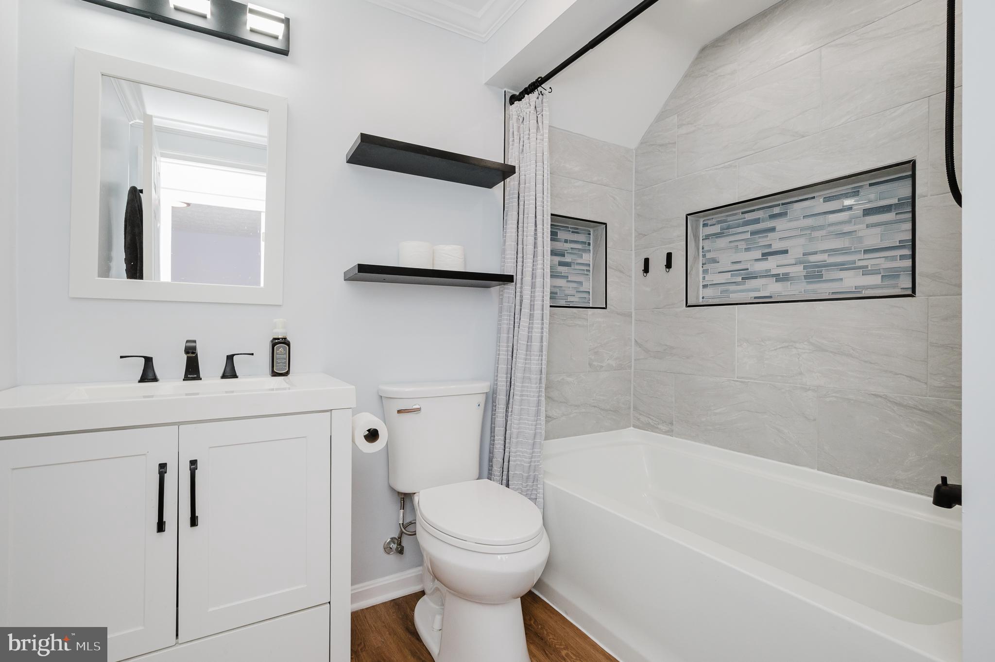 930 Edmund Street Aberdeen, MD 21001 - Photo 46 of 61 a bathroom with a sink a toilet and a bathtub