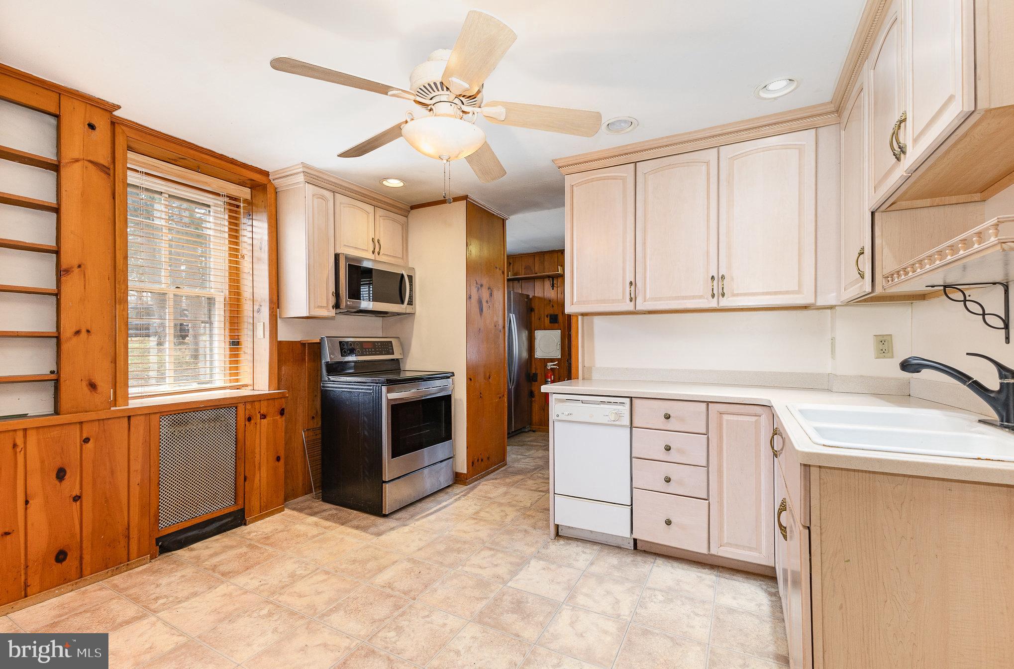 2500 Doehne Road Harrisburg, PA 17110 - Photo 12 of 42 a kitchen with stainless steel appliances granite countertop a stove top oven a sink dishwasher and a refrigerator with the cabinets