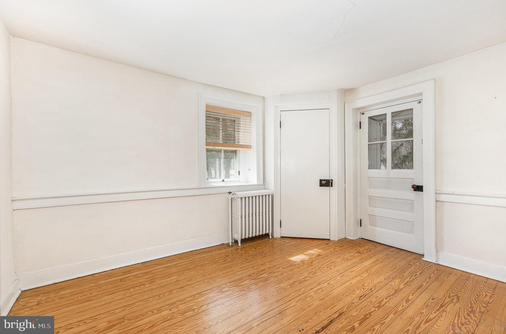 2500 Doehne Road Harrisburg, PA 17110 - Photo 20 of 42 a view of an empty room with window and wooden floor