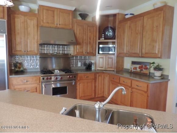 613 Academy Heights Road Kinston, NC 28504 - Photo 26 of 49 Gas commercial stove. Custom Cabinets with built in sliders