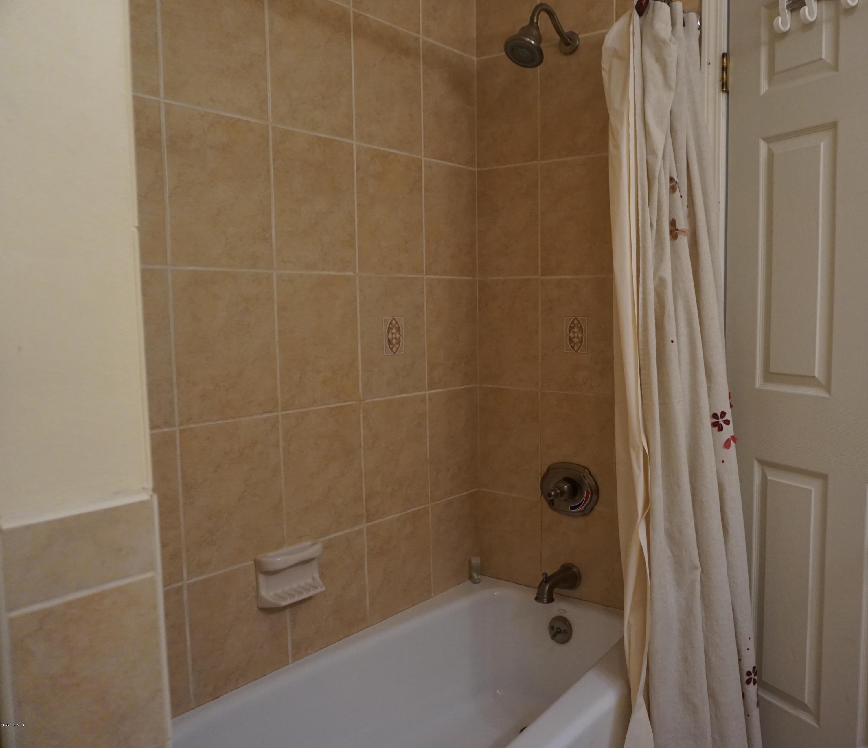 27 Maple Road Richmond, MA 01201 - Photo 14 of 16 a bathroom with a bathtub
