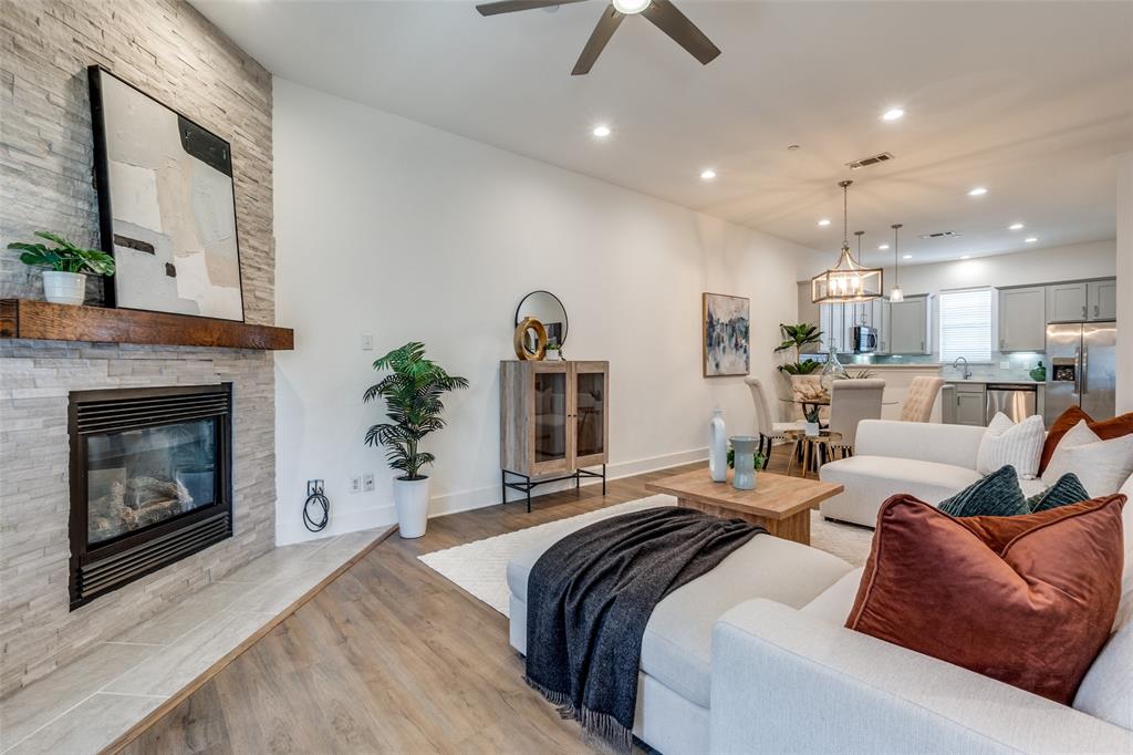 5743 Prospect Avenue, Unit 103 Dallas, TX 75206 - Photo 1 of 1 a large bedroom with a large bed and a fireplace