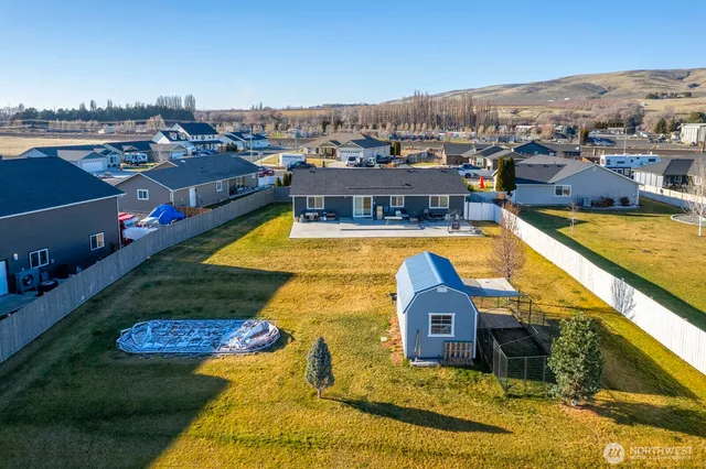 a view of a swimming pool with seating area