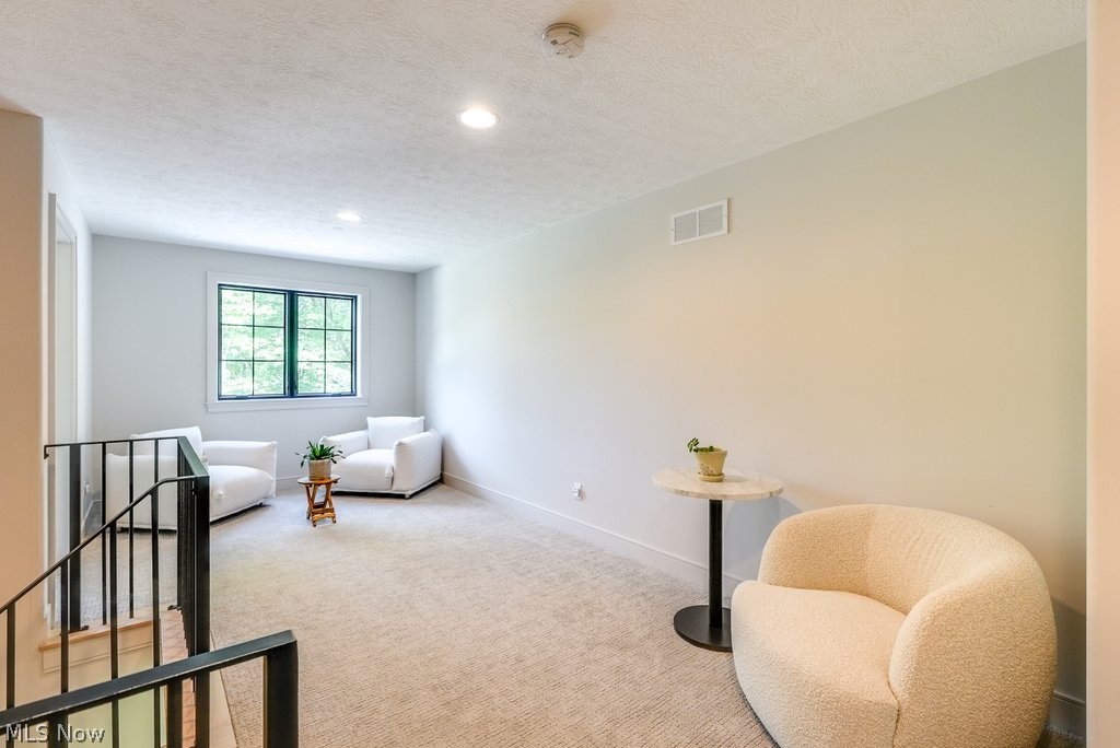 3040 Lander Road Pepper Pike, OH 44124 - Photo 19 of 38 Sitting room with carpet and a textured ceiling