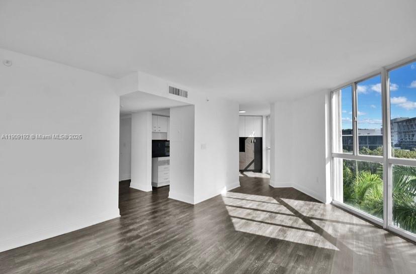 1688 West Avenue, Unit 602 Miami Beach, FL 33139 - Photo 14 of 61 a view of a livingroom with wooden floor and a window