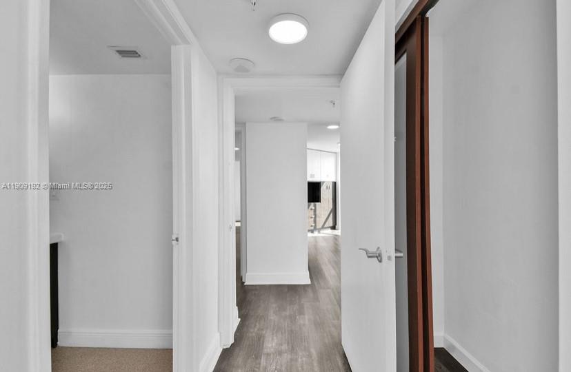 1688 West Avenue, Unit 602 Miami Beach, FL 33139 - Photo 50 of 61 a view of a bathroom with a sink and a mirror