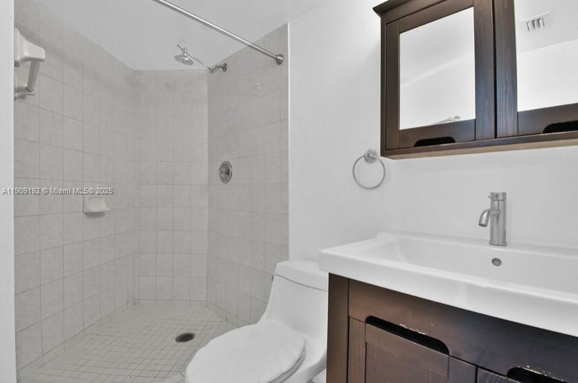 1688 West Avenue, Unit 602 Miami Beach, FL 33139 - Photo 53 of 61 a bathroom with a sink a toilet and shower