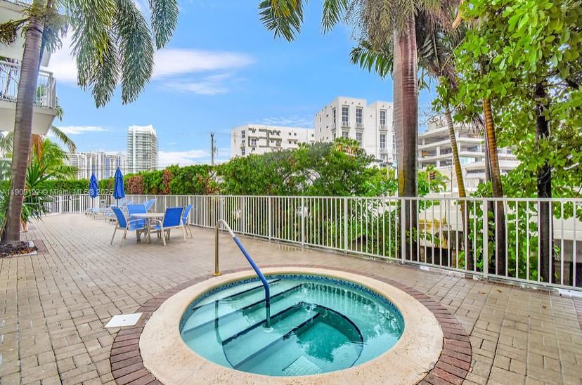 1688 West Avenue, Unit 602 Miami Beach, FL 33139 - Photo 59 of 61 a swimming pool with outdoor seating yard and barbeque oven