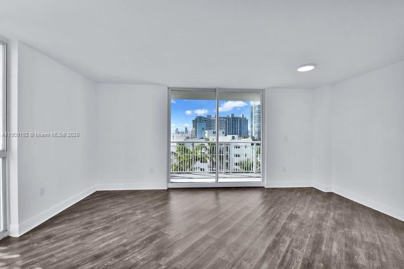 1688 West Avenue, Unit 602 Miami Beach, FL 33139 - Photo 7 of 61 a view of a room with wooden floor and window