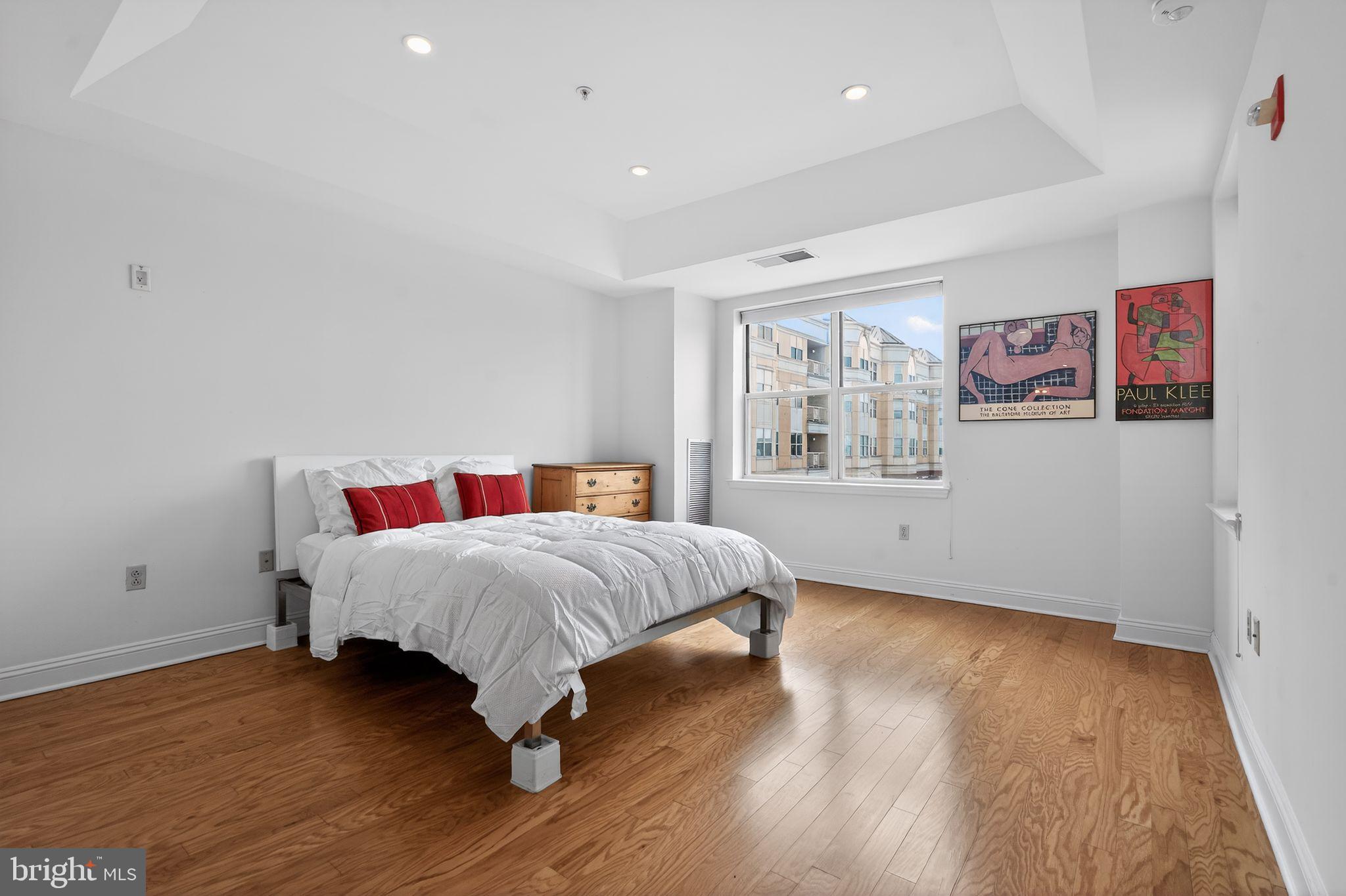 2205 Windrow Drive Princeton, NJ 08540 - Photo 12 of 24 a bedroom with a bed and wooden floor