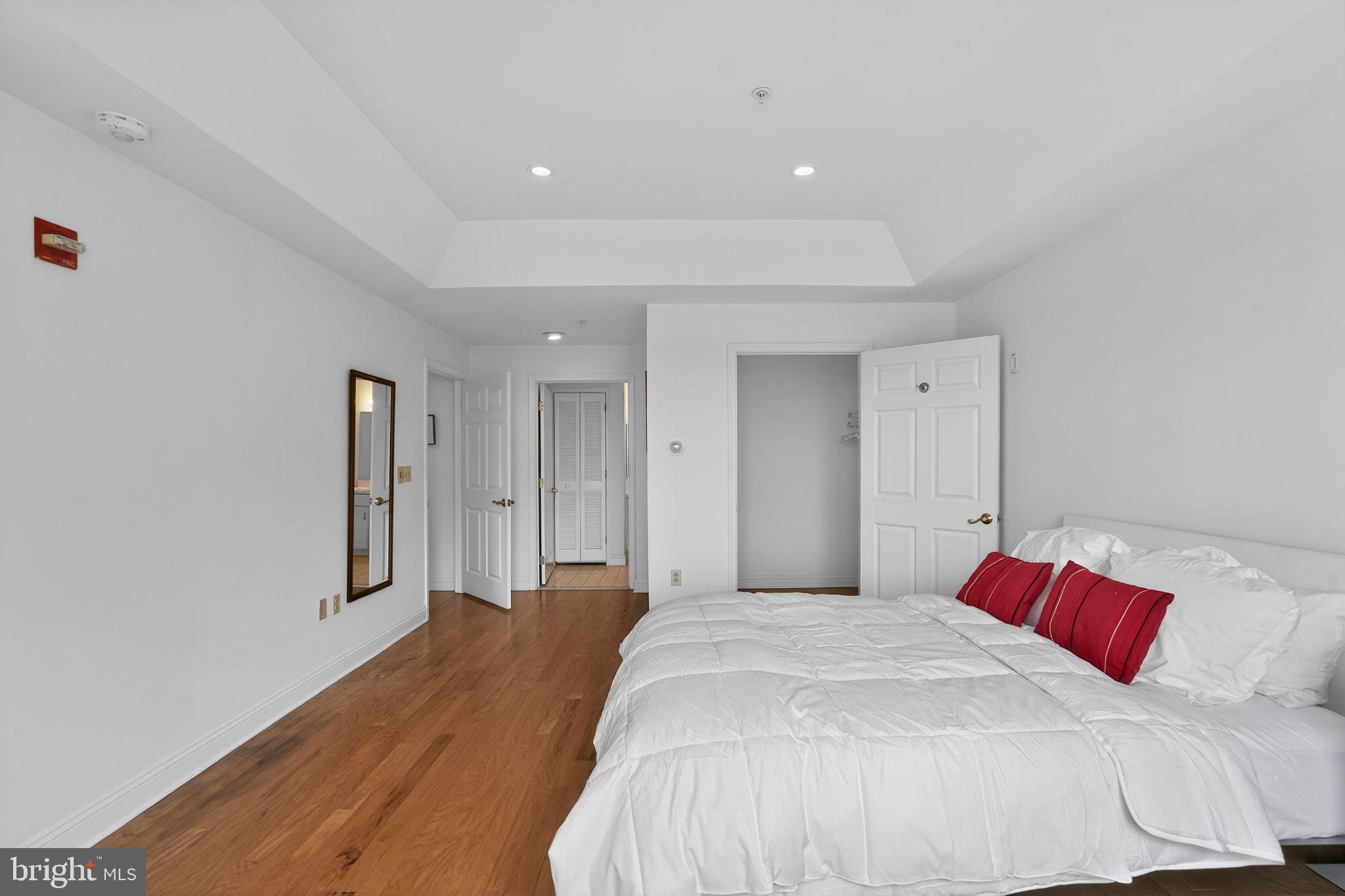 2205 Windrow Drive Princeton, NJ 08540 - Photo 13 of 24 a bedroom with a large bed and a chandelier