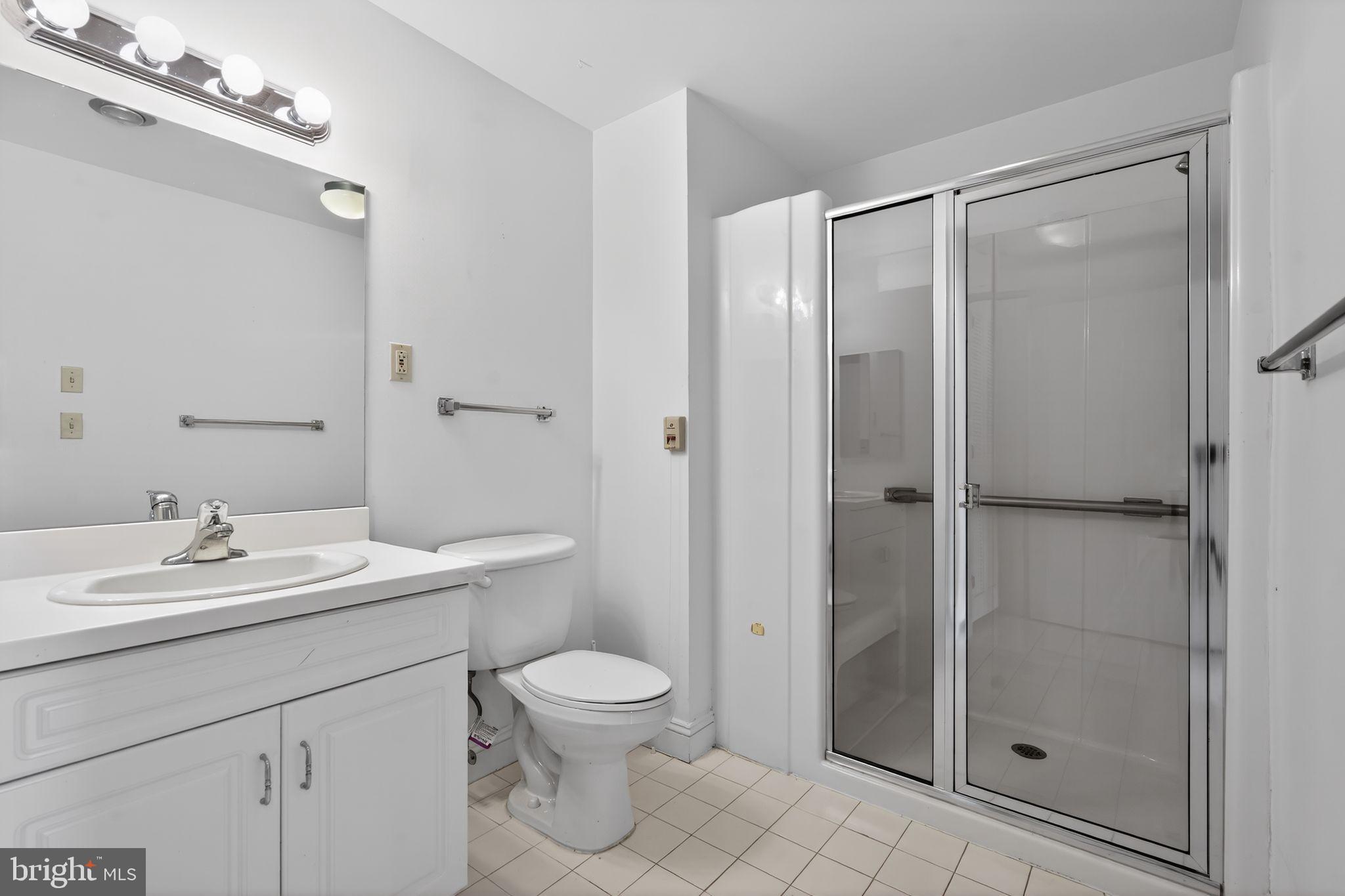 2205 Windrow Drive Princeton, NJ 08540 - Photo 15 of 24 a bathroom with a sink a toilet and shower