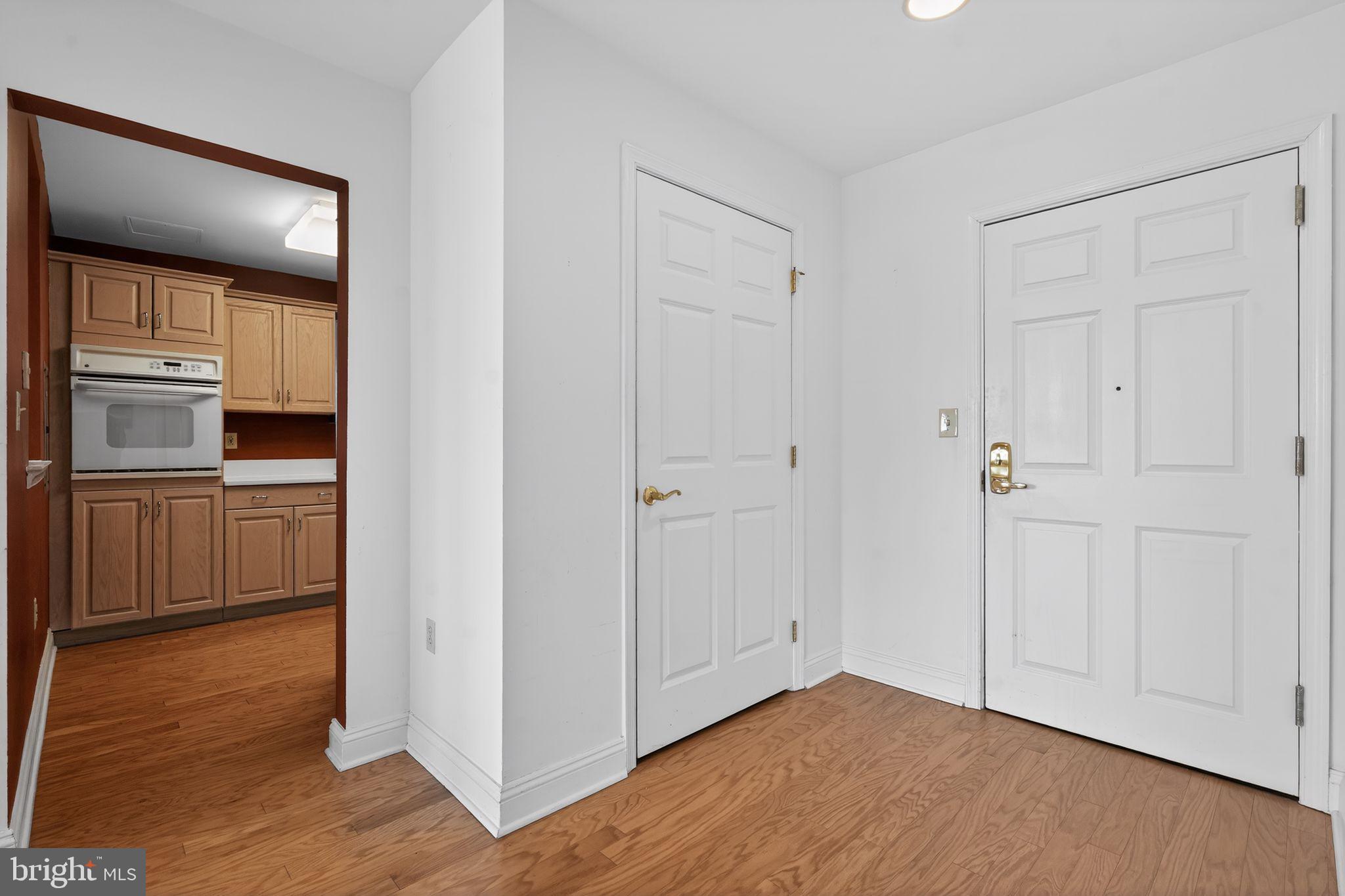 2205 Windrow Drive Princeton, NJ 08540 - Photo 5 of 24 a view of a kitchen with wooden floor electronic appliances and windows