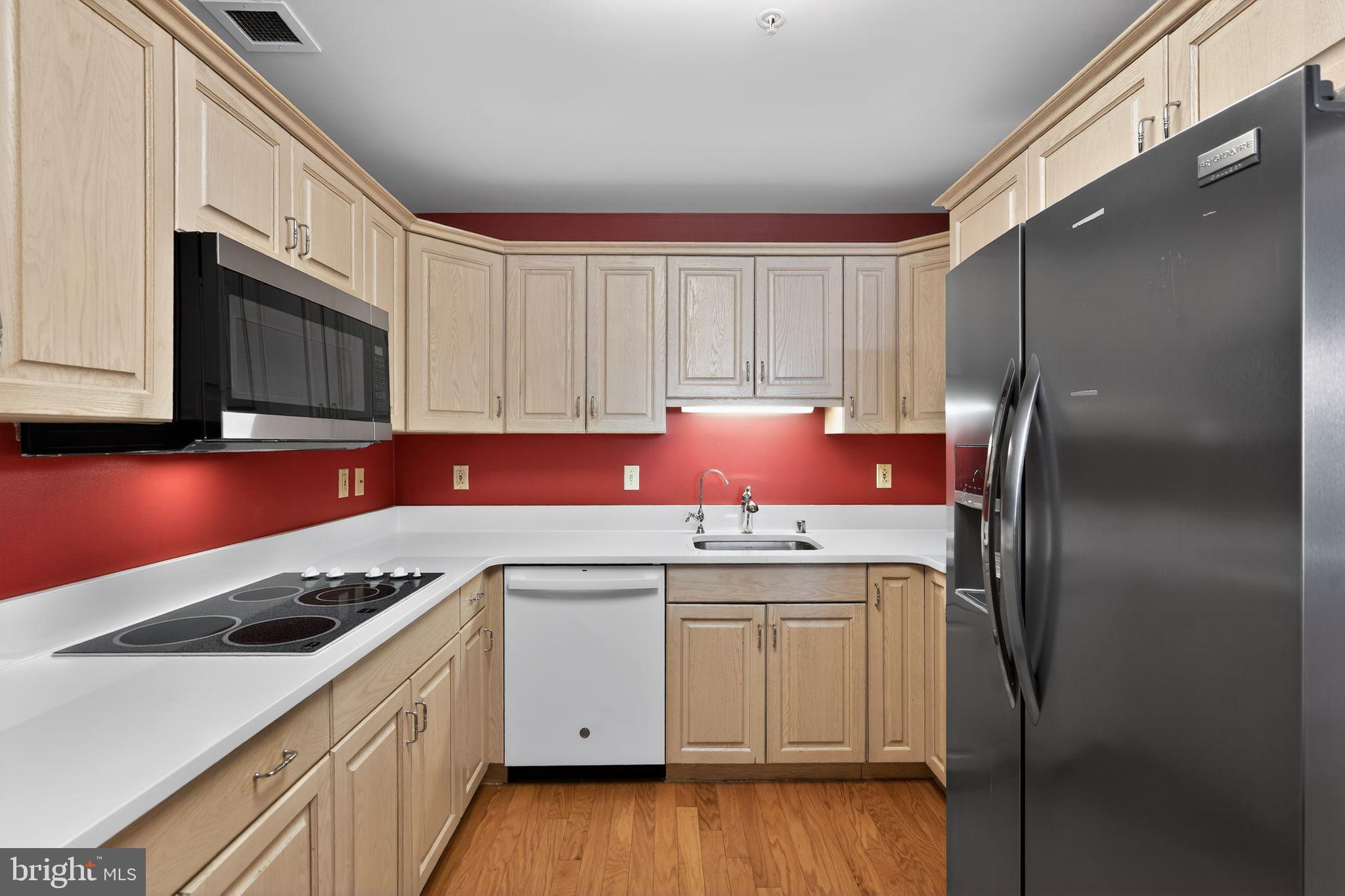 2205 Windrow Drive Princeton, NJ 08540 - Photo 10 of 24 a kitchen with stainless steel appliances granite countertop a sink stove and refrigerator