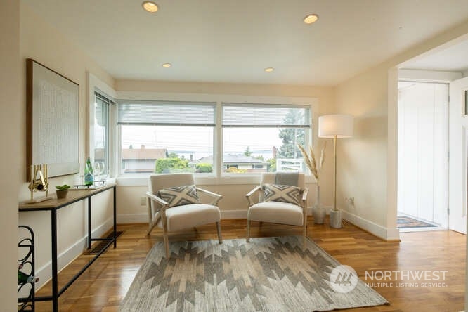 9340 45th Avenue Southwest Seattle, WA 98136 - Photo 11 of 33 a living room with furniture and large windows