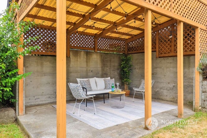 9340 45th Avenue Southwest Seattle, WA 98136 - Photo 20 of 33 a patio with glass top table and chairs