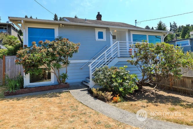 9340 45th Avenue Southwest Seattle, WA 98136 - Photo 2 of 33 a front view of a house with garden