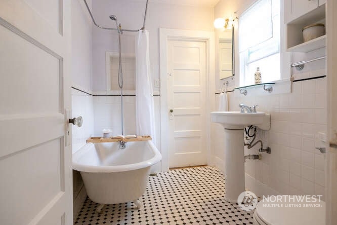 9340 45th Avenue Southwest Seattle, WA 98136 - Photo 26 of 33 a bathroom with a sink a toilet and shower