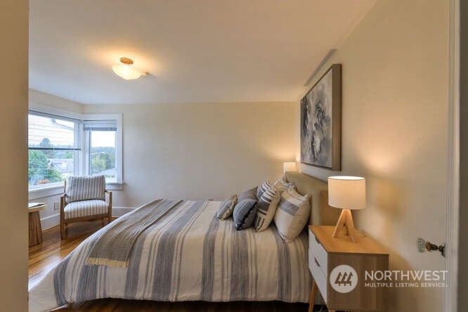 9340 45th Avenue Southwest Seattle, WA 98136 - Photo 28 of 33 a bedroom with a bed and a window