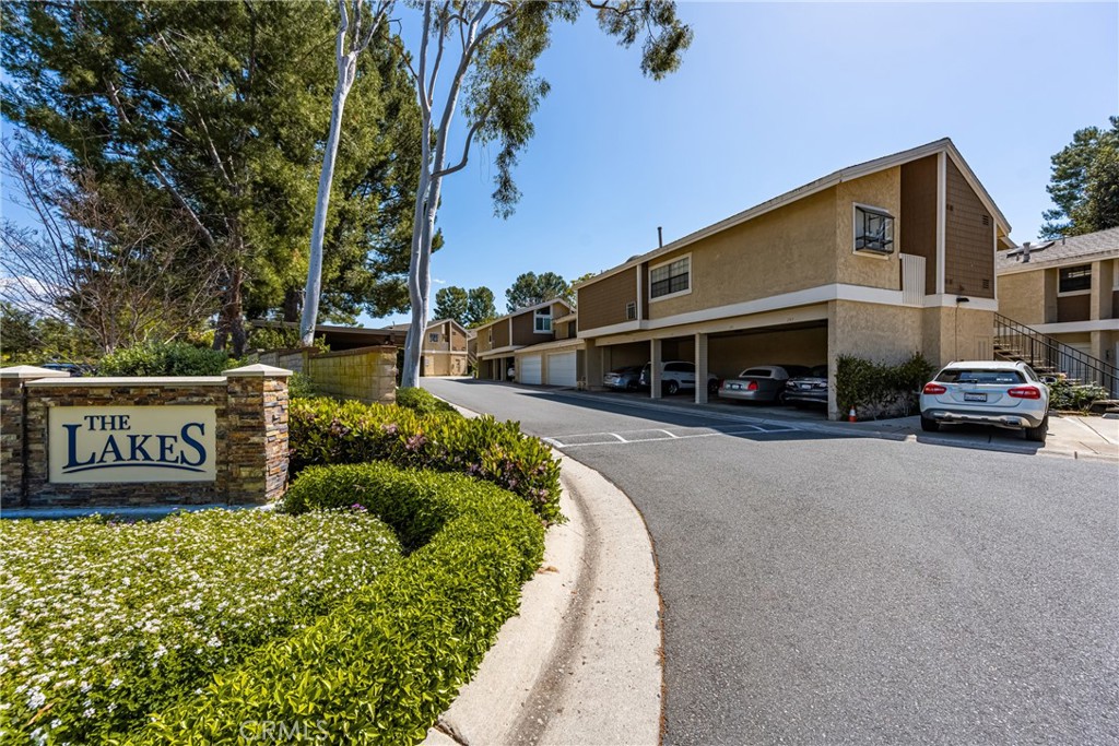179 Pineview Irvine, CA 92620 - Photo 41 of 51 Both parking spots can be seen - one uncovered and one covered - unit is just beyond the stairs shown in the background.