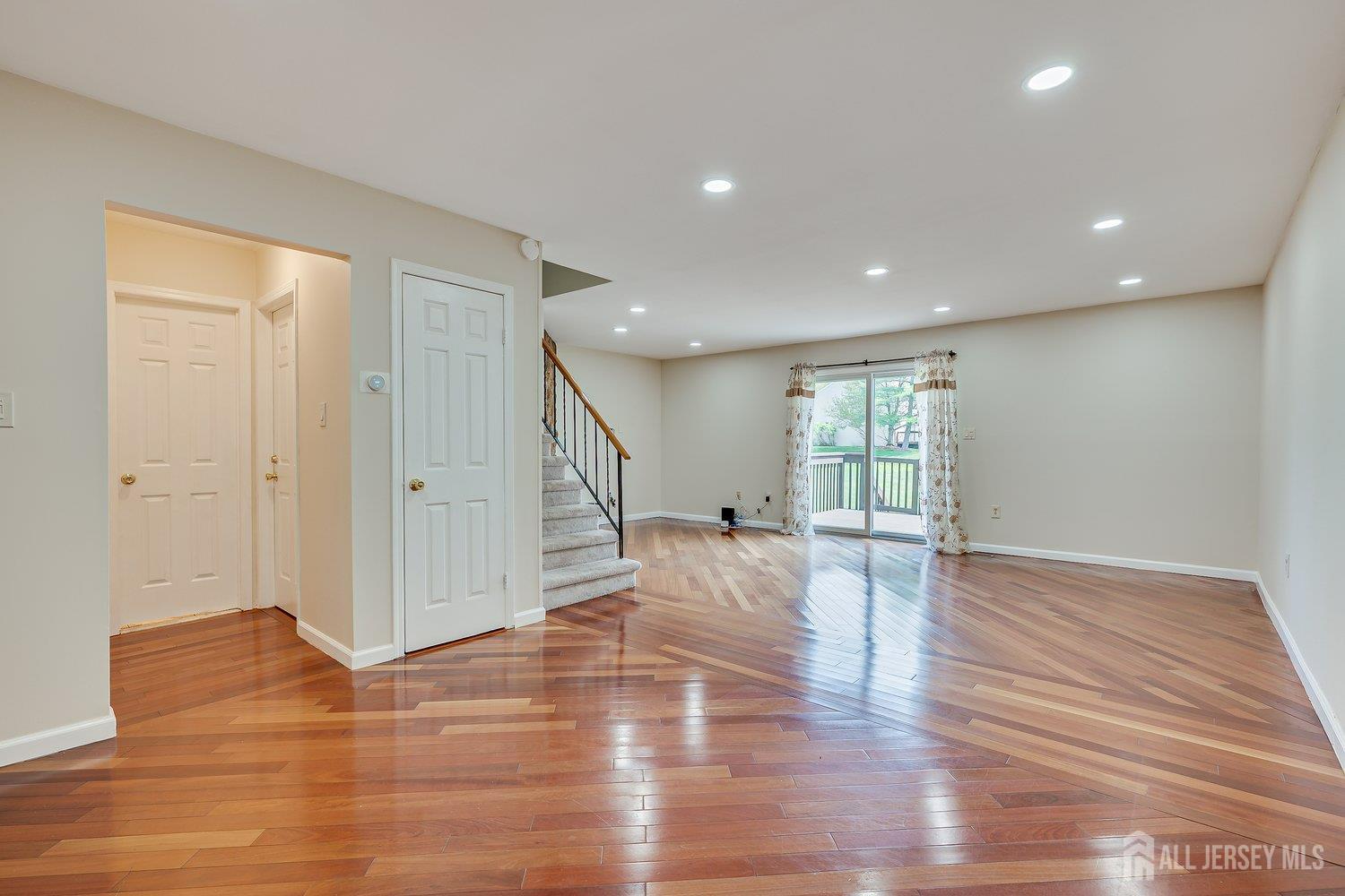 7 Lily Court Edison, NJ 08820 - Photo 11 of 32 a view of empty room with wooden floor