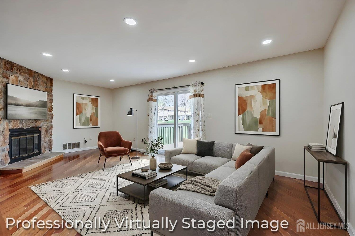 7 Lily Court Edison, NJ 08820 - Photo 13 of 32 a living room with furniture or couch and a fireplace