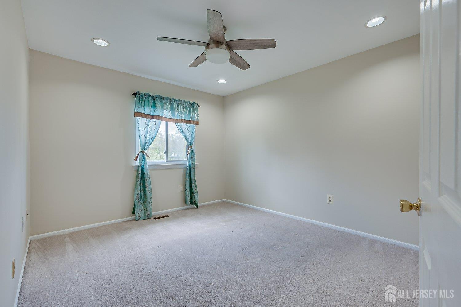 7 Lily Court Edison, NJ 08820 - Photo 19 of 32 wooden floor in an empty room with a window