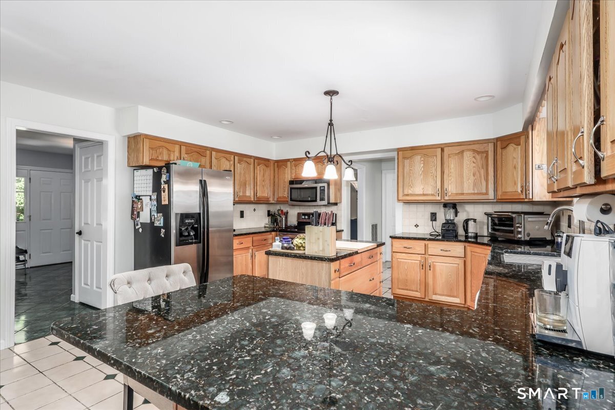 55 A Flax Hill Road Brookfield, CT 06804 - Photo 13 of 40 a large kitchen with stainless steel appliances granite countertop a stove refrigerator and cabinets
