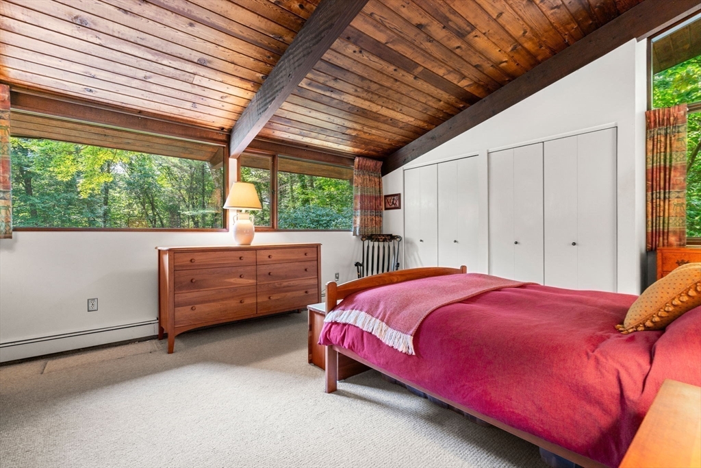 60 Pine Street Dover, MA 02030 - Photo 24 of 36 a bedroom with a bed and a window