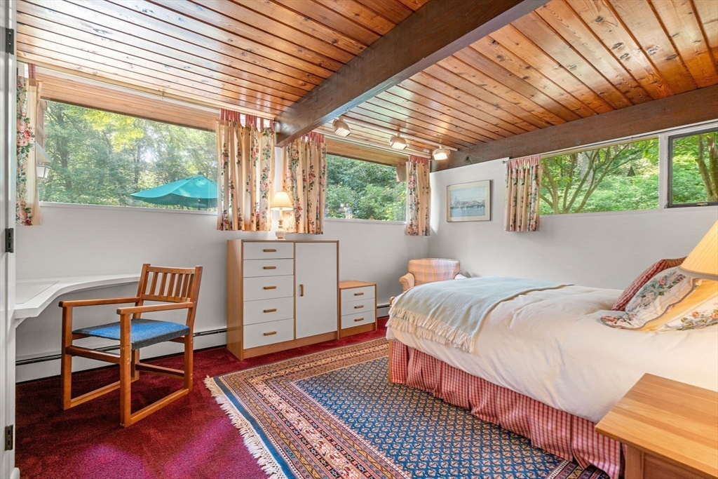 60 Pine Street Dover, MA 02030 - Photo 25 of 36 a bedroom with a bed and a window