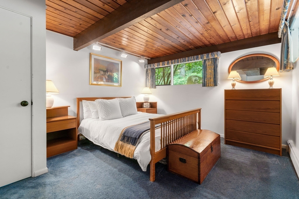 60 Pine Street Dover, MA 02030 - Photo 32 of 36 a bedroom with a bed and a dresser