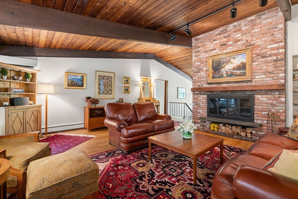 60 Pine Street Dover, MA 02030 - Photo 9 of 36 a living room with furniture a rug and a fireplace