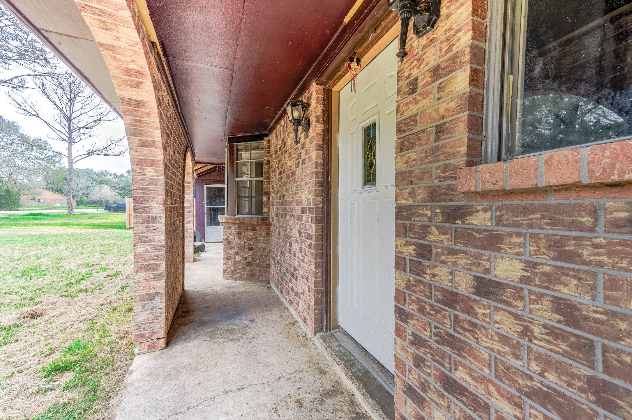 1431 County Road 934 Sweeny, TX 77480 - Photo 18 of 21 a view of a brick house with a yard