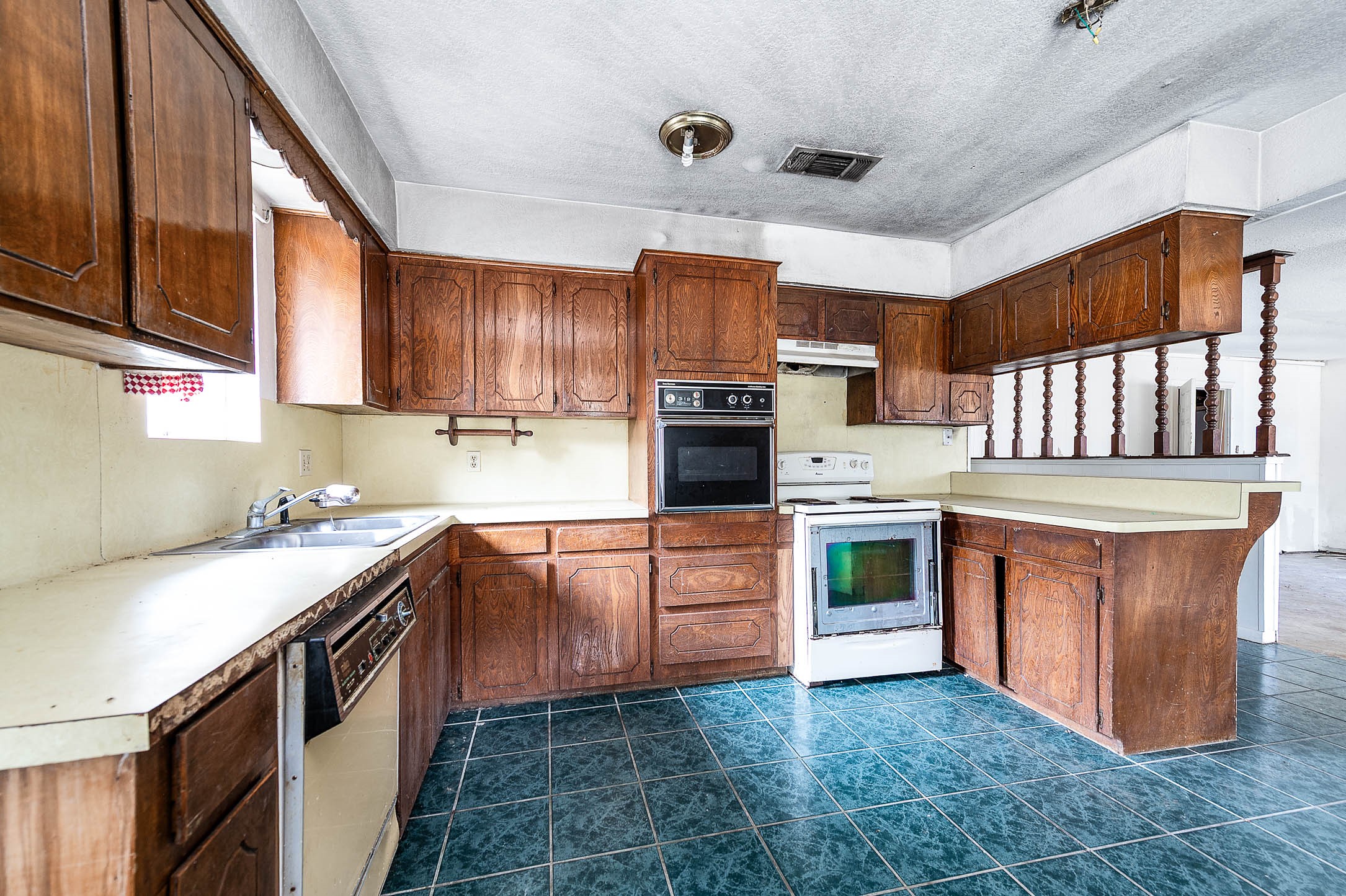 1431 County Road 934 Sweeny, TX 77480 - Photo 3 of 21 a kitchen with stainless steel appliances granite countertop a stove sink and cabinets
