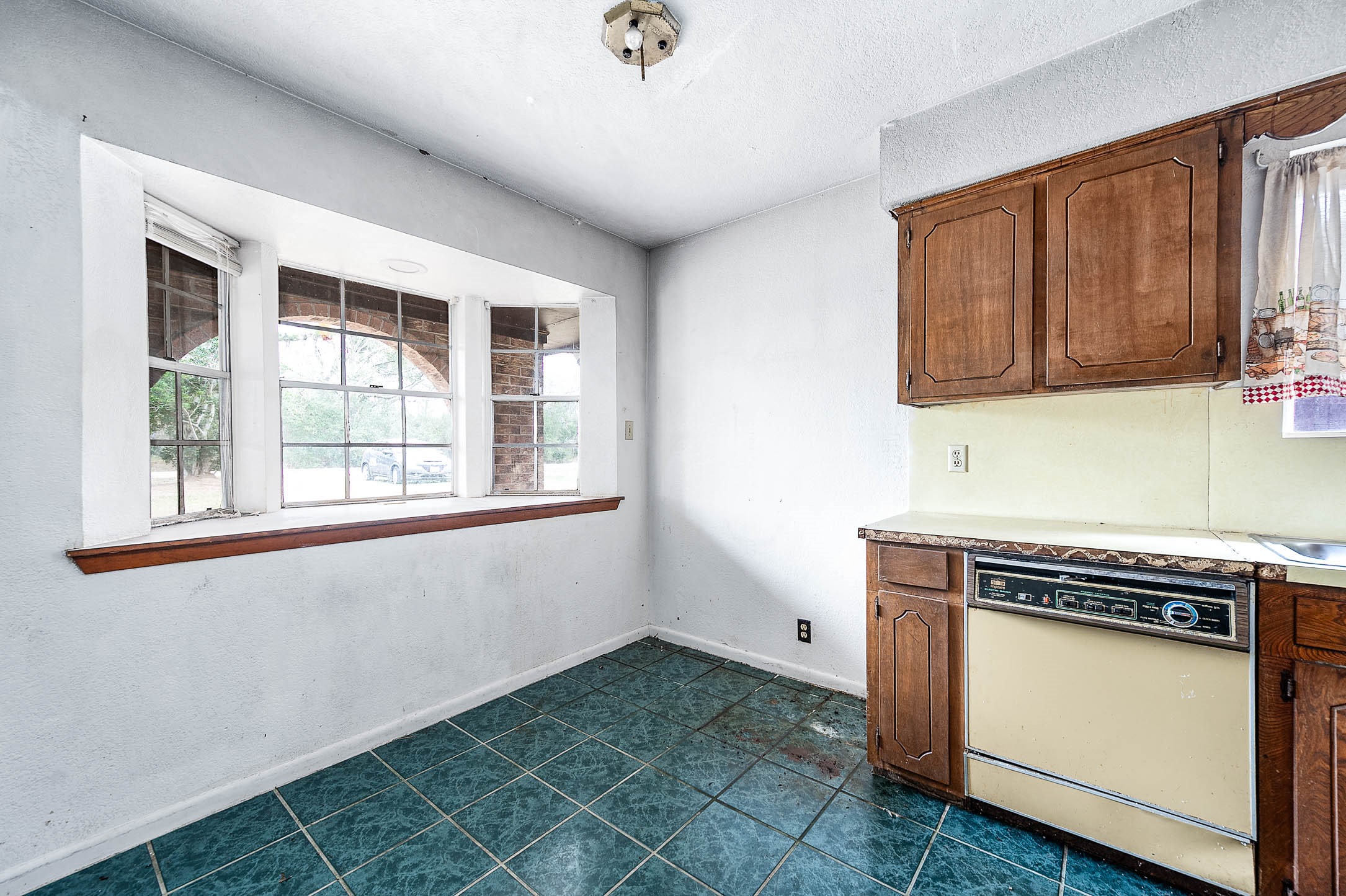 1431 County Road 934 Sweeny, TX 77480 - Photo 4 of 21 a view of a kitchen with a sink cabinets and a window