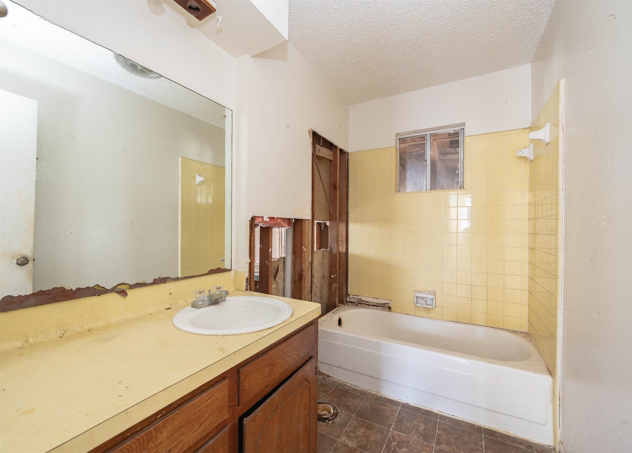 1431 County Road 934 Sweeny, TX 77480 - Photo 8 of 21 a bathroom with a granite countertop sink and a bathtub