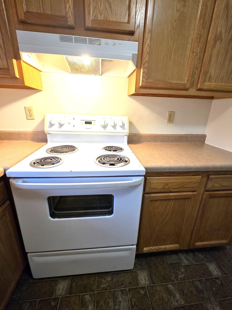 331 West Main Street Olney, IL 62450 - Photo 15 of 58 a stove top oven sitting inside of a kitchen