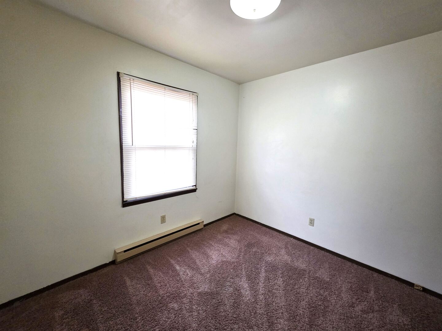 331 West Main Street Olney, IL 62450 - Photo 27 of 58 an empty room with a window