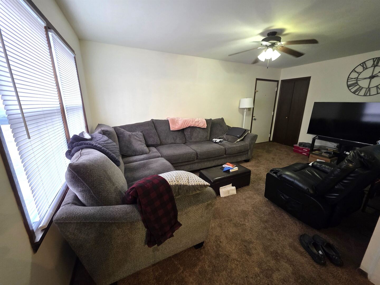 331 West Main Street Olney, IL 62450 - Photo 34 of 58 a living room with furniture a flat screen tv and a window