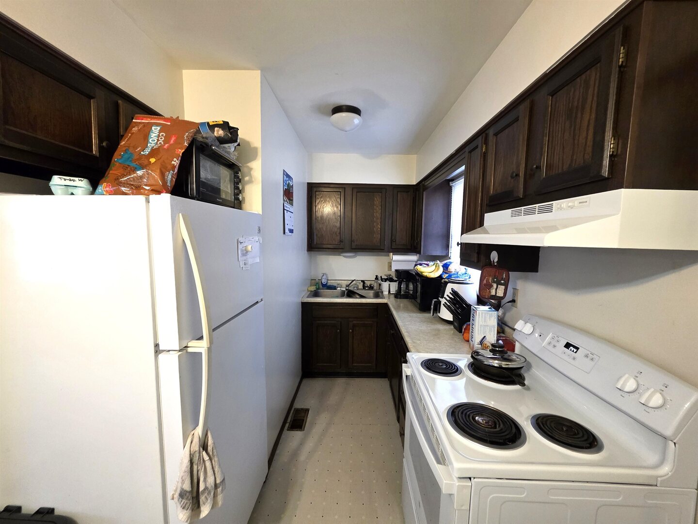 331 West Main Street Olney, IL 62450 - Photo 39 of 58 a kitchen with a sink a stove and refrigerator