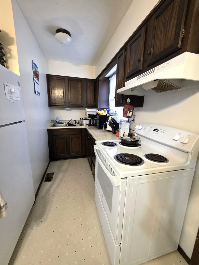 331 West Main Street Olney, IL 62450 - Photo 40 of 58 a kitchen that has a sink and a stove