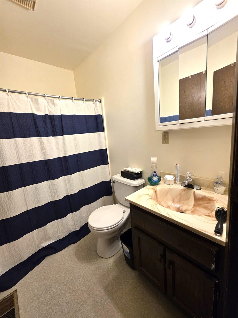 331 West Main Street Olney, IL 62450 - Photo 47 of 58 a bathroom with a sink and a mirror